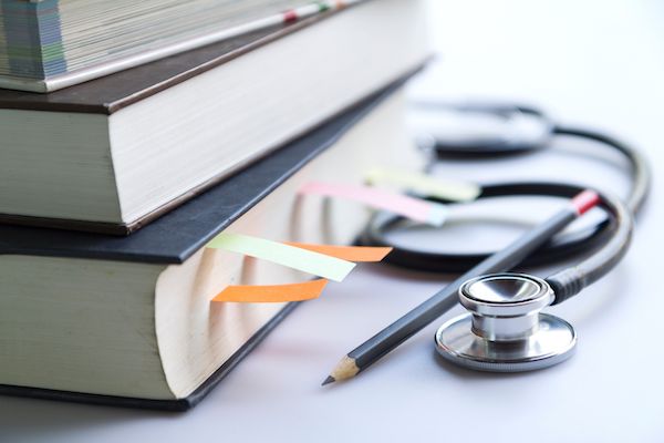 Stethoscope and medical books